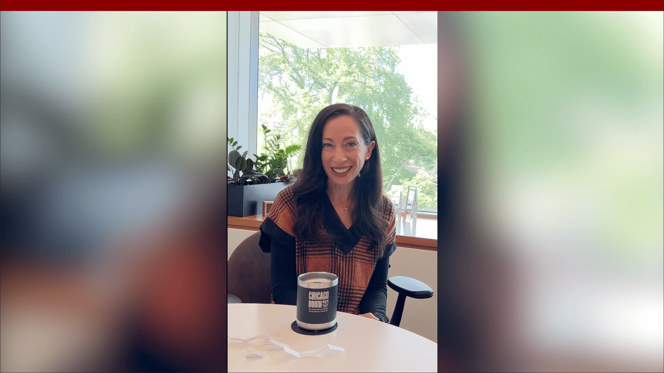 Starr Marcello smiling sitting at a table