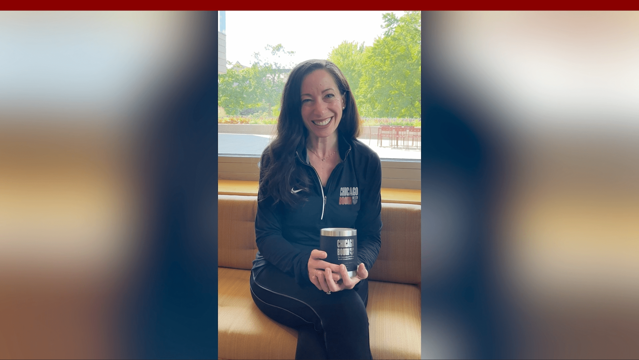 Video thumbnail of Starr Marcello smiling with a Chicago Booth mug