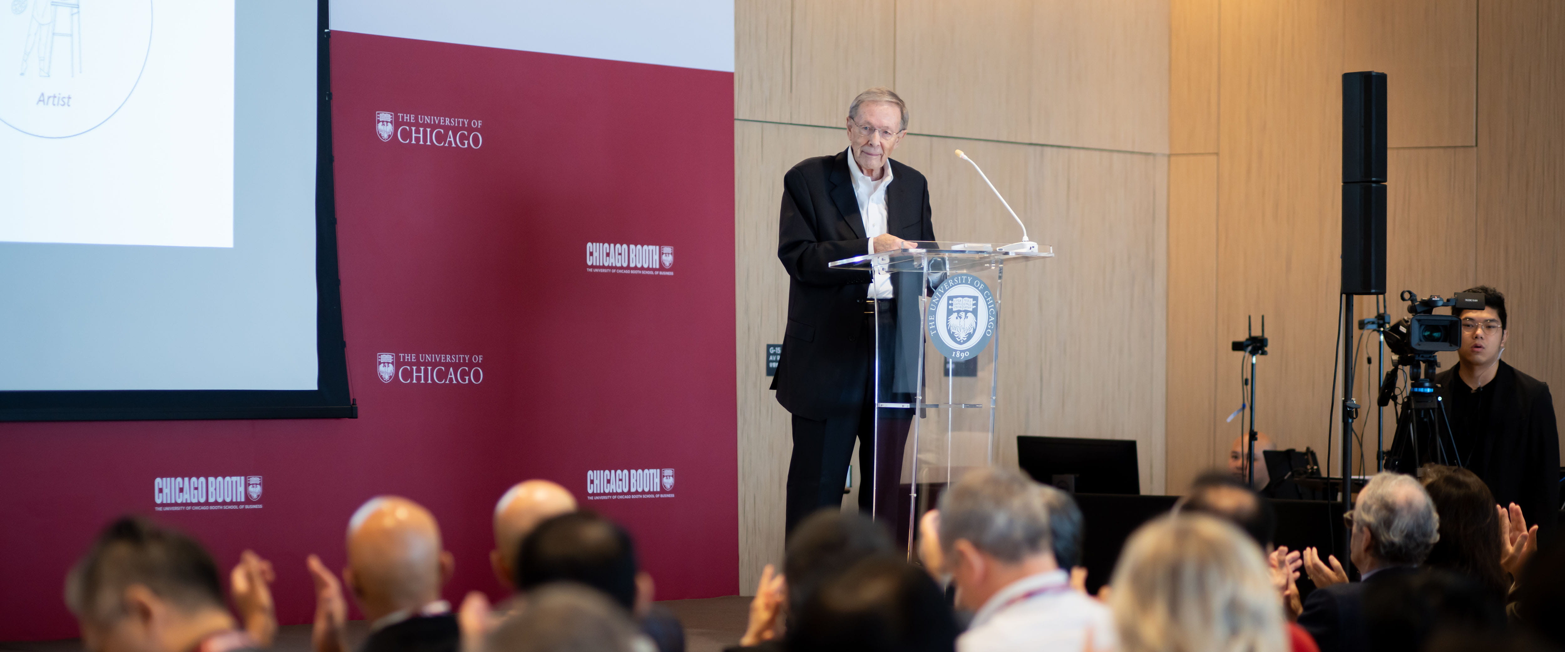 Harry Davis standing at a podium at an event 