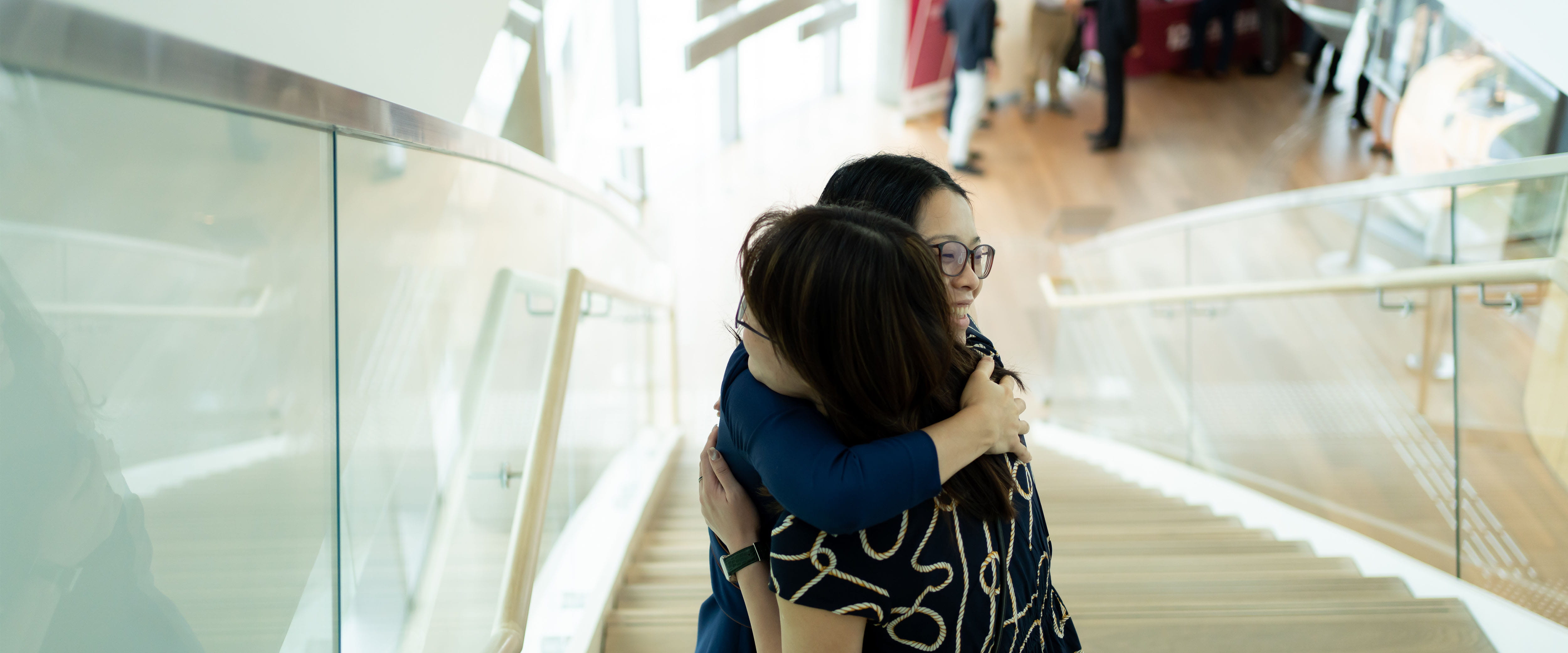 Two people hugging on the stairwell