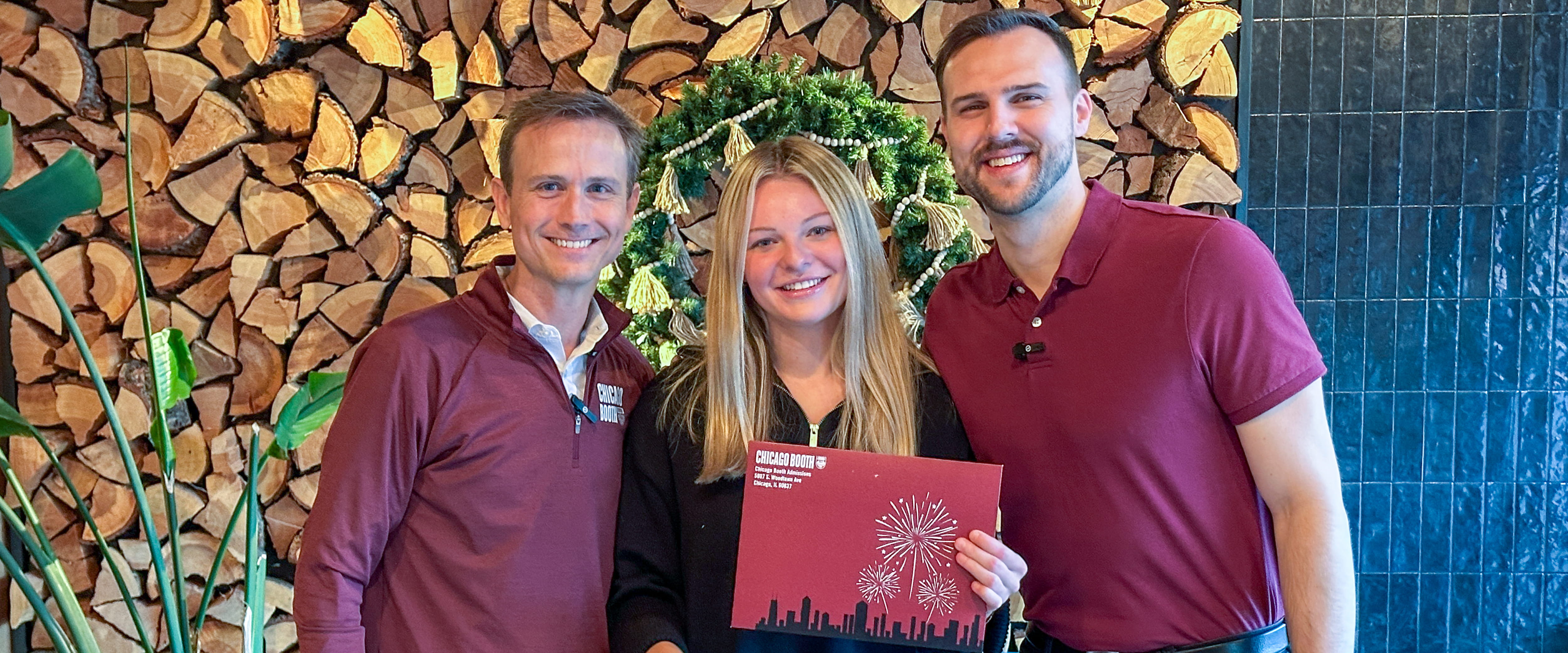 Keeley Shaye Kandziora posing with two Booth Admissions representatives 