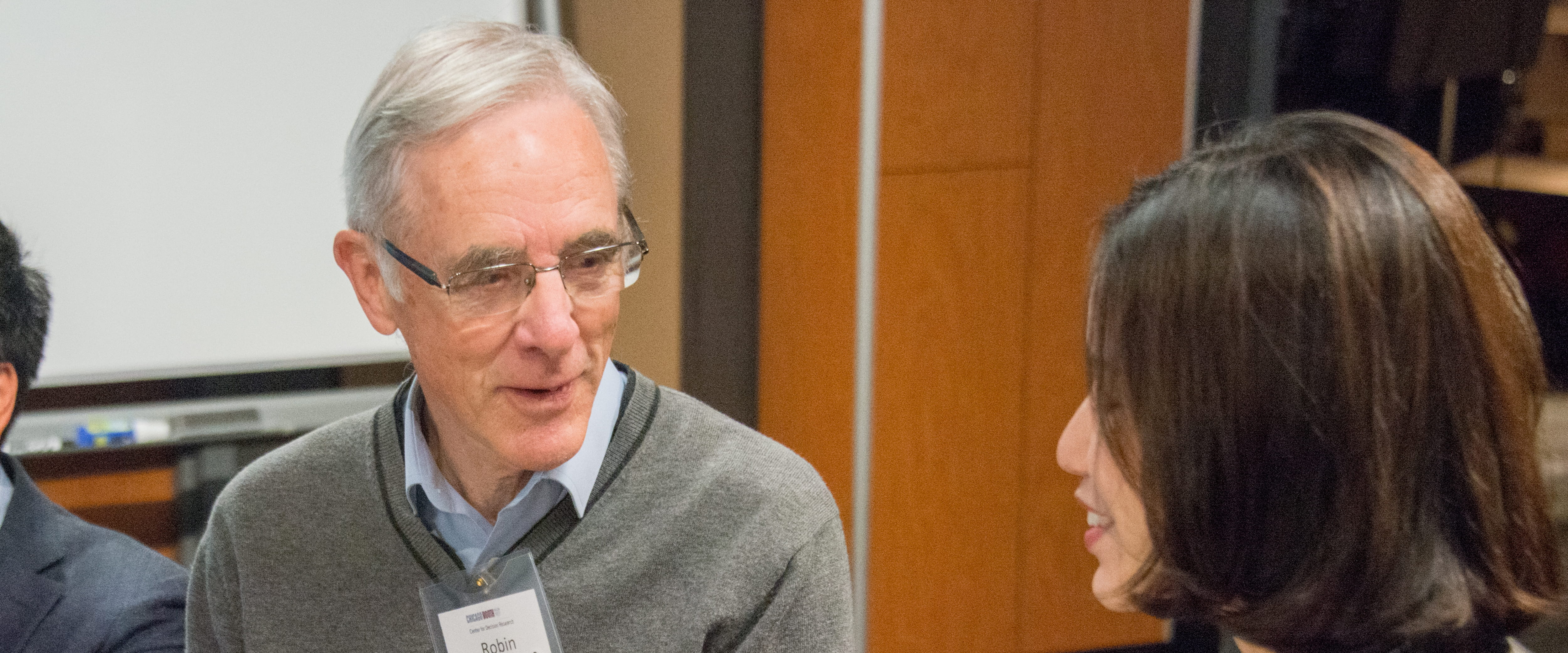 Robin Hogarth talking with a student