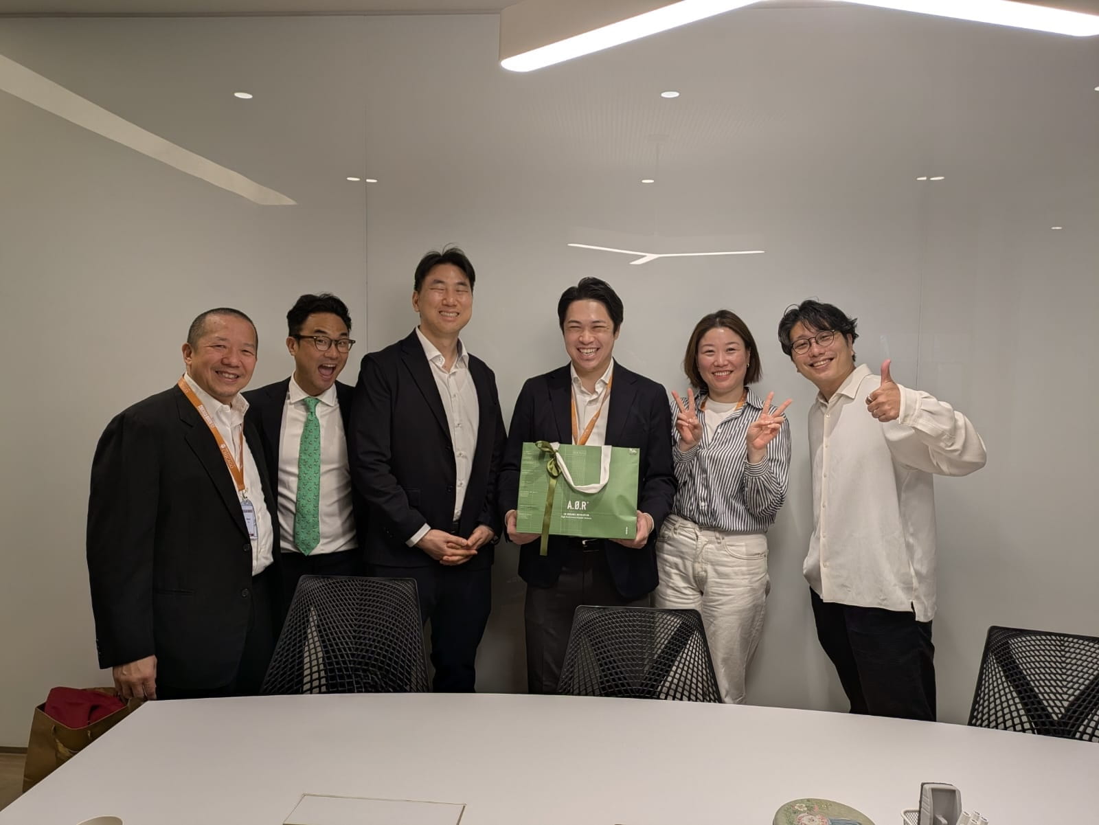 A group of six people looking at the camera