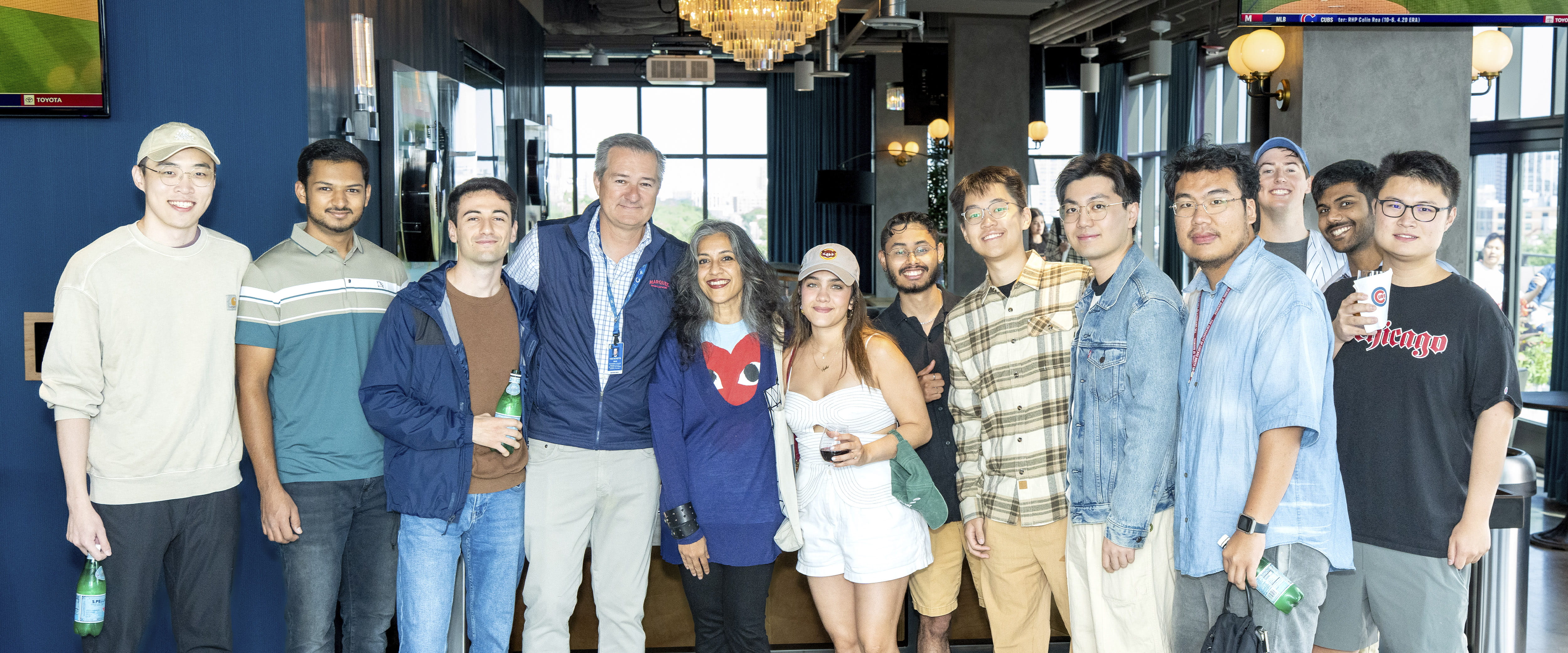 group photo of students with Tom Ricketts