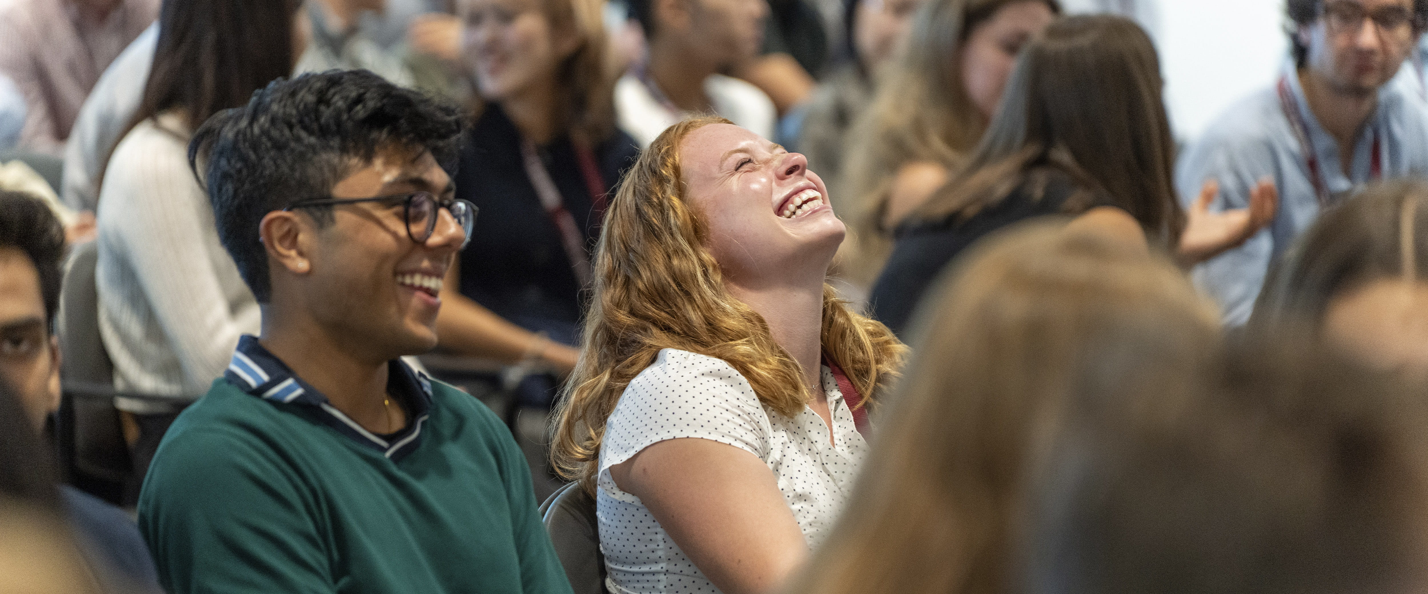 Two students laughing 