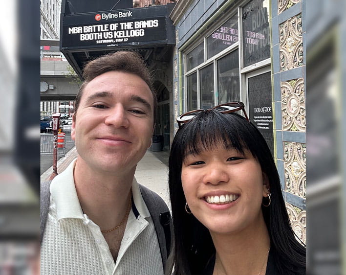 selfie of Jenett Cheng and friend in front of Battle of the Bands sign at Aragon Ballroom