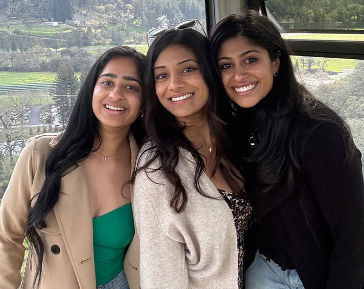 Trisha Atluri with two friends smiling