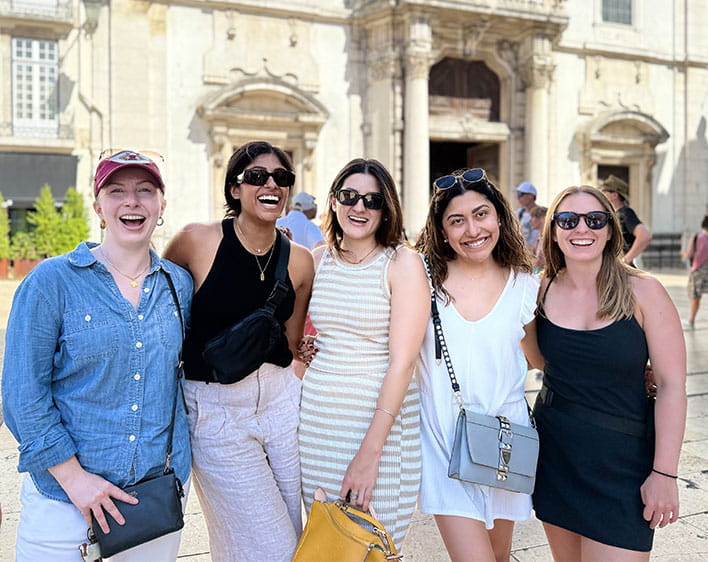 Trisha Atluri with four friends outside smiling 
