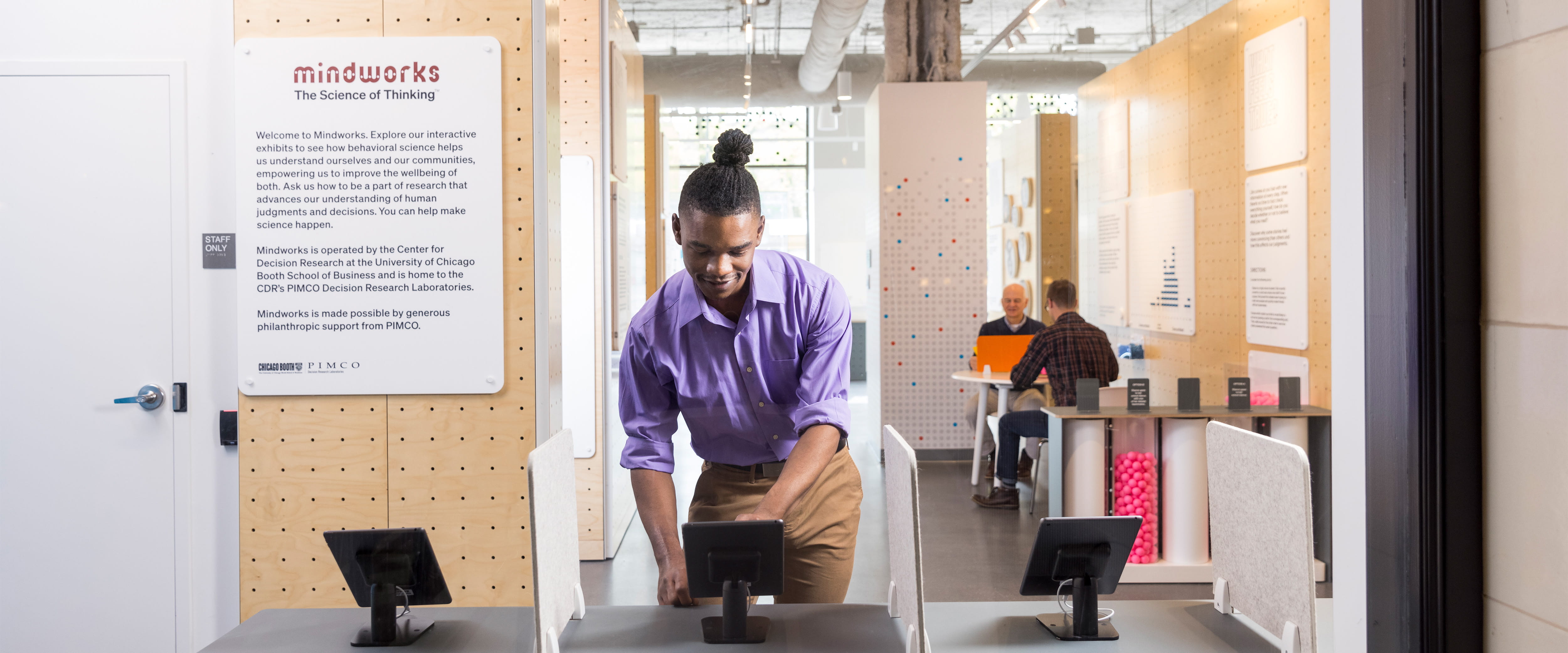 A man touching a tablet at Mindworks.