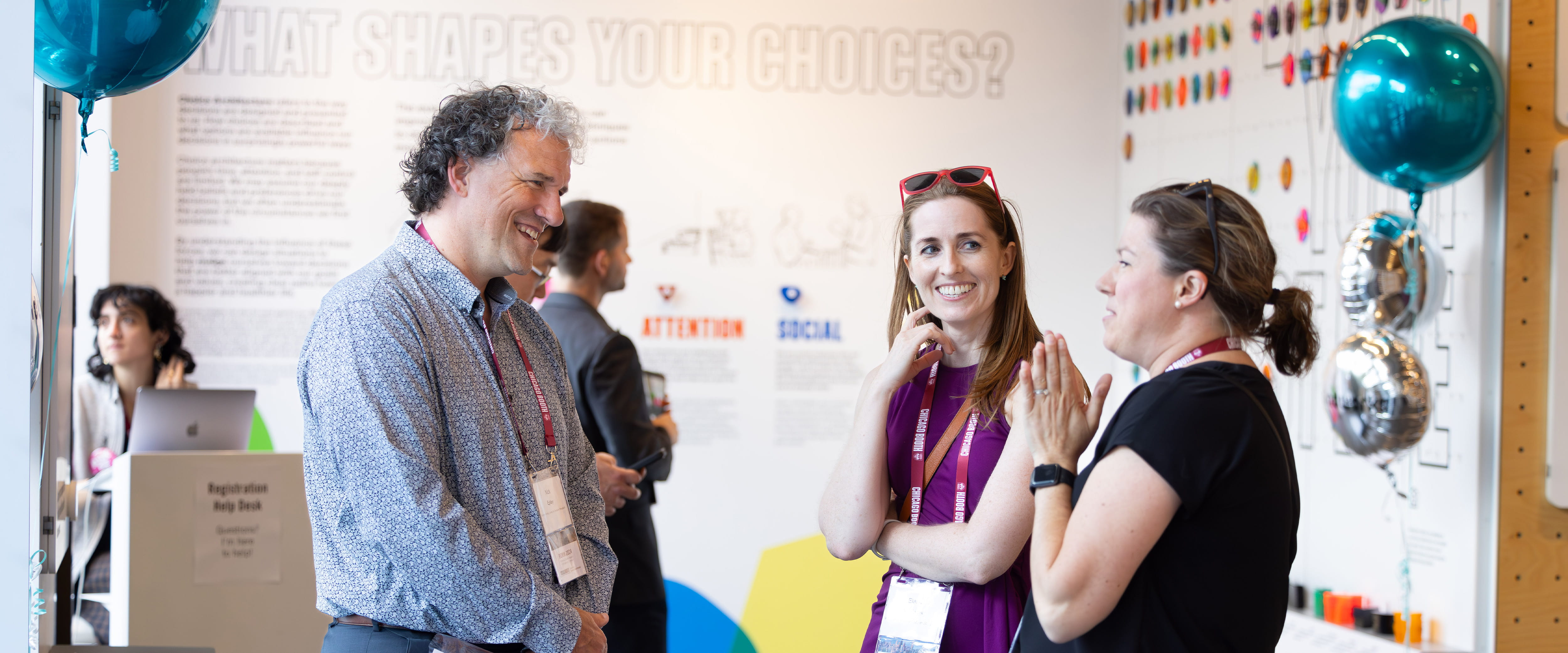 Nicholas Epley talks with people at Mindworks.