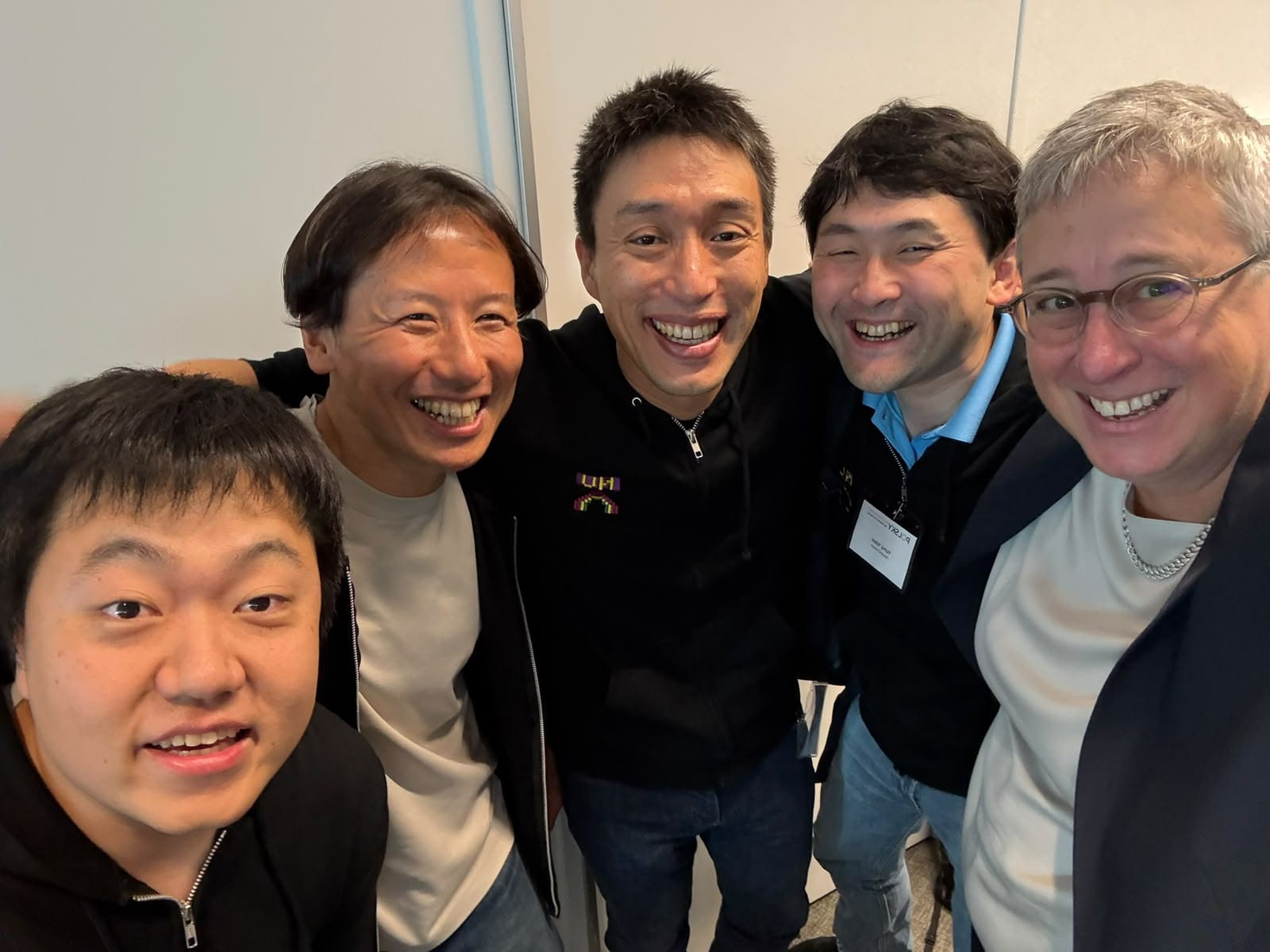 Five men smiling at the camera