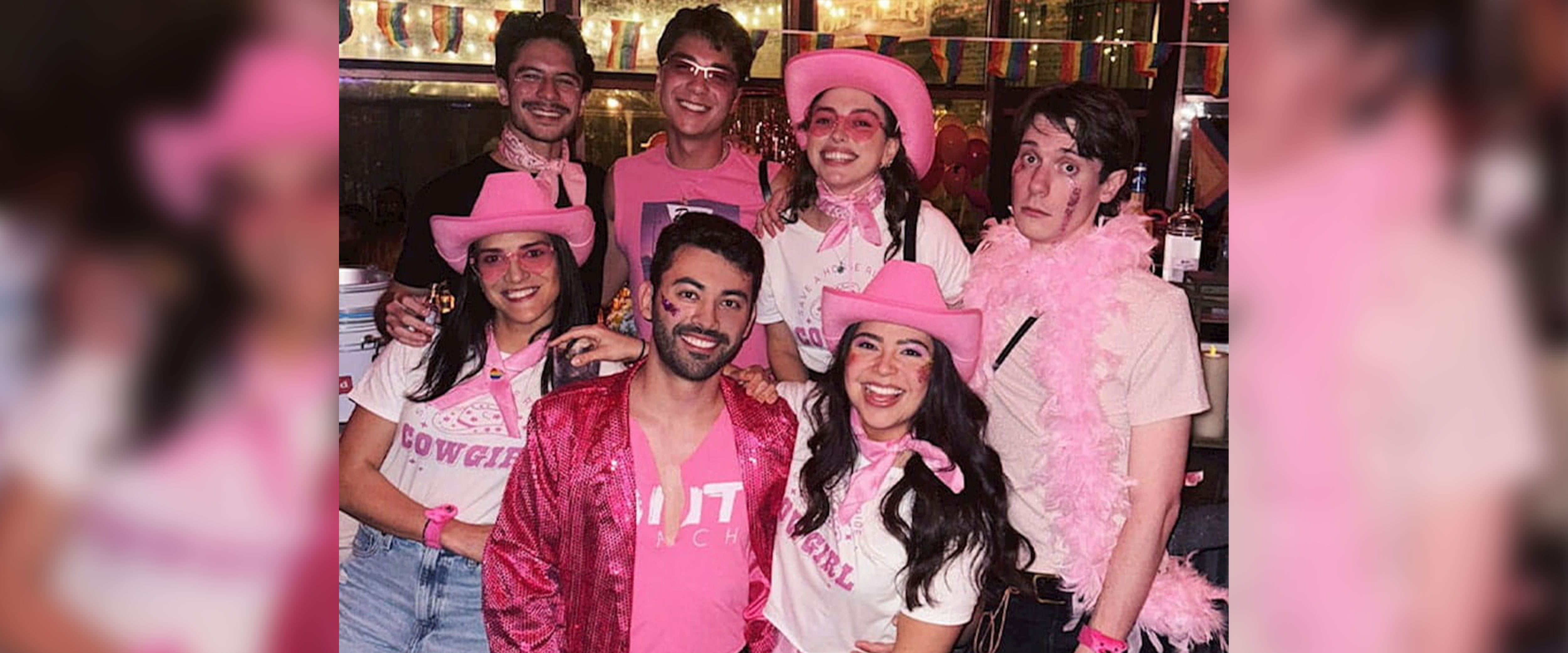 group of students at OUTreach event in all pink smiling