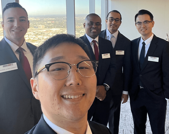 selfie of David Kim and four other Boothies in formal suits