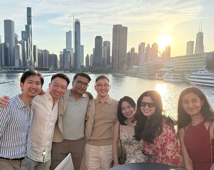 David Kim and boothies on boat smiling
