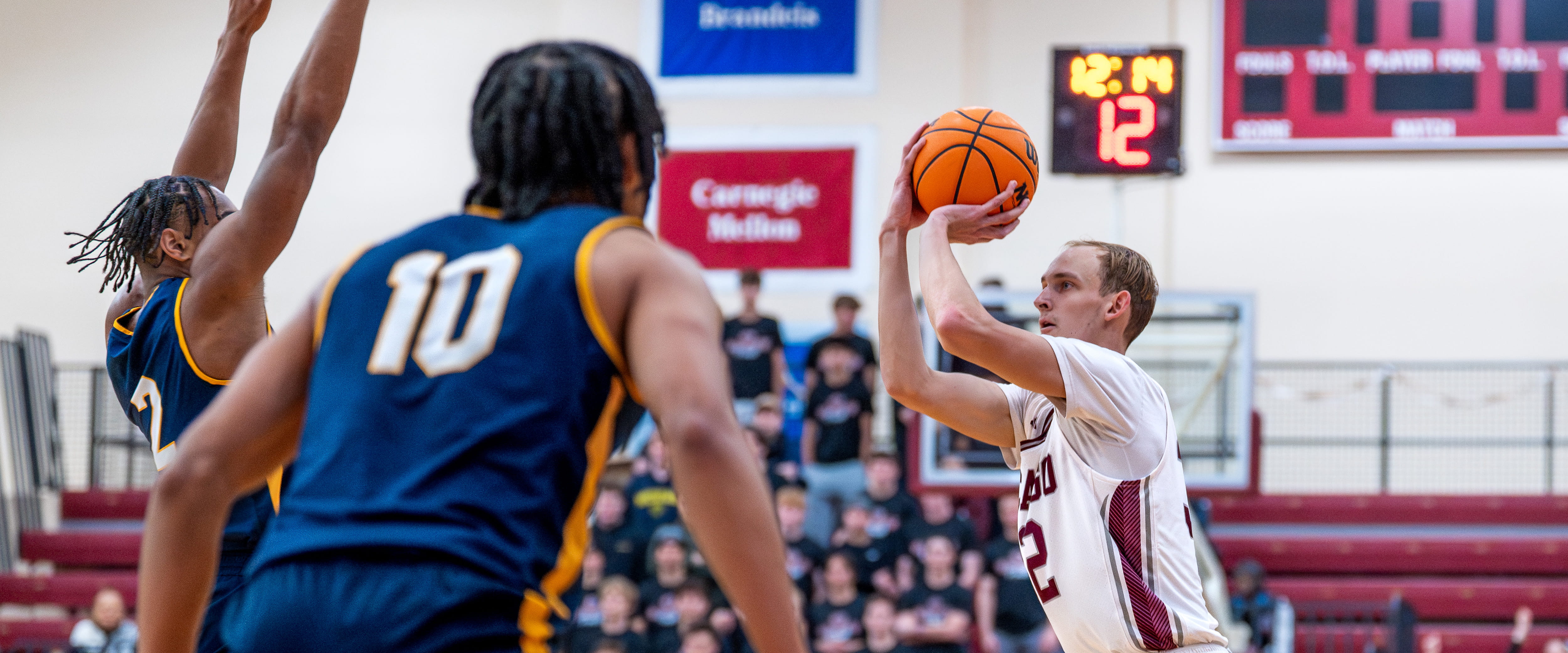 SMP Basketball Player Nick Roper shooting a basket
