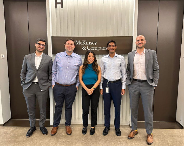 Selena at McKinsey and Company smiling with four people