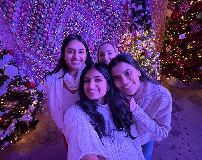selfie of Tanvi Gopalabhatla and friends with purple lightling 