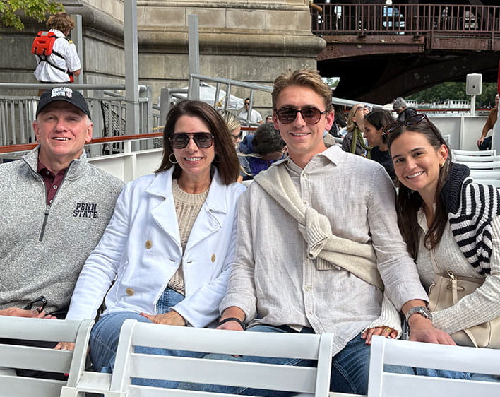 Mayes Lane with loved ones on boat smiling