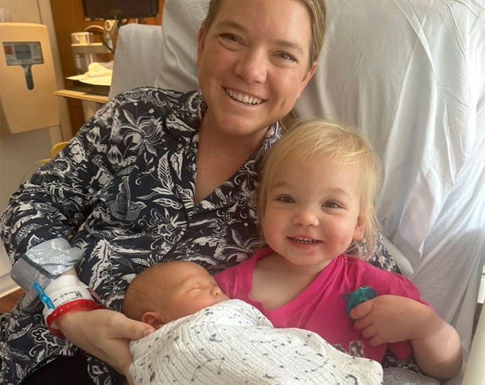 Madison Davis with her daughter and newborn son at the hospital