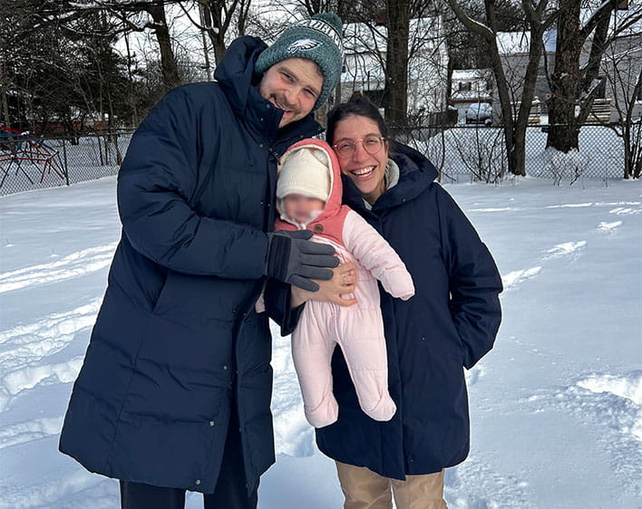 Naama Elazar and family outside in snow smiling