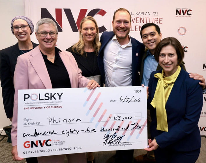 Philipp Gschöpf and John Fabros holding up winning check alongside other individuals for GNVC