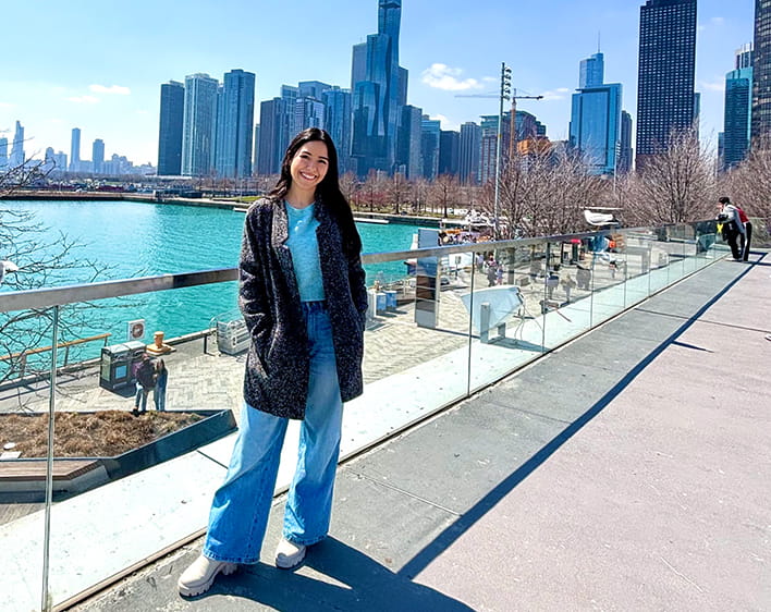 Camila Parra Ochoa smiling downtown Chicago with skyline in background 