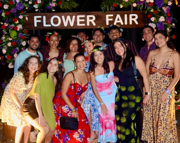 Camila Parra Ochoa with group of Boothies at Flower Fair event smiling in group photo