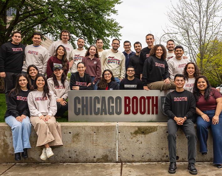 group photo of HABSA members outside of Harper Center in front of Chicago Booth sign