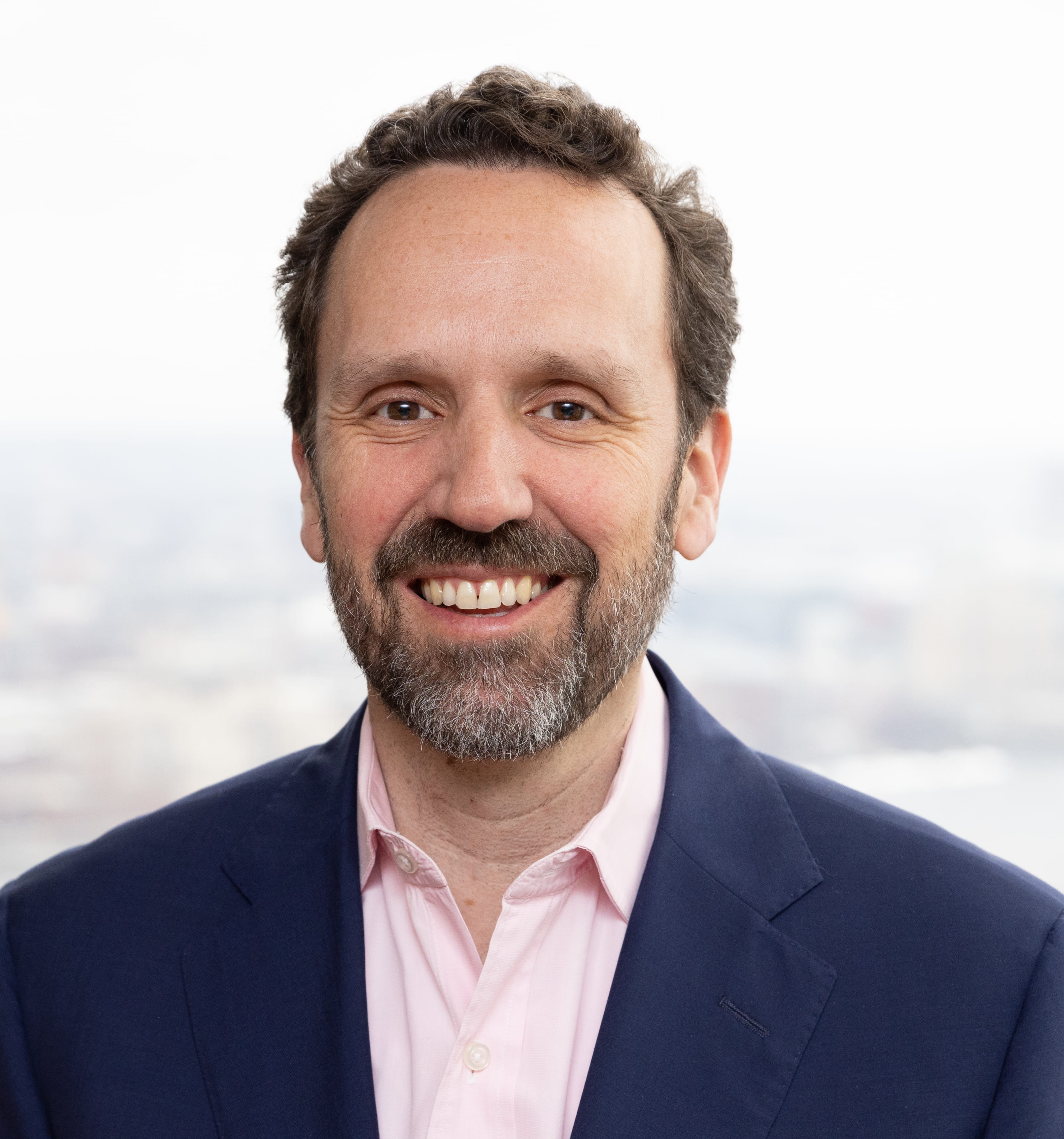 Andrew Hack Smiles in Headshot