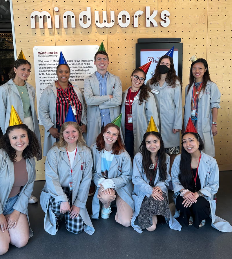 Research assistants in birthday party hats