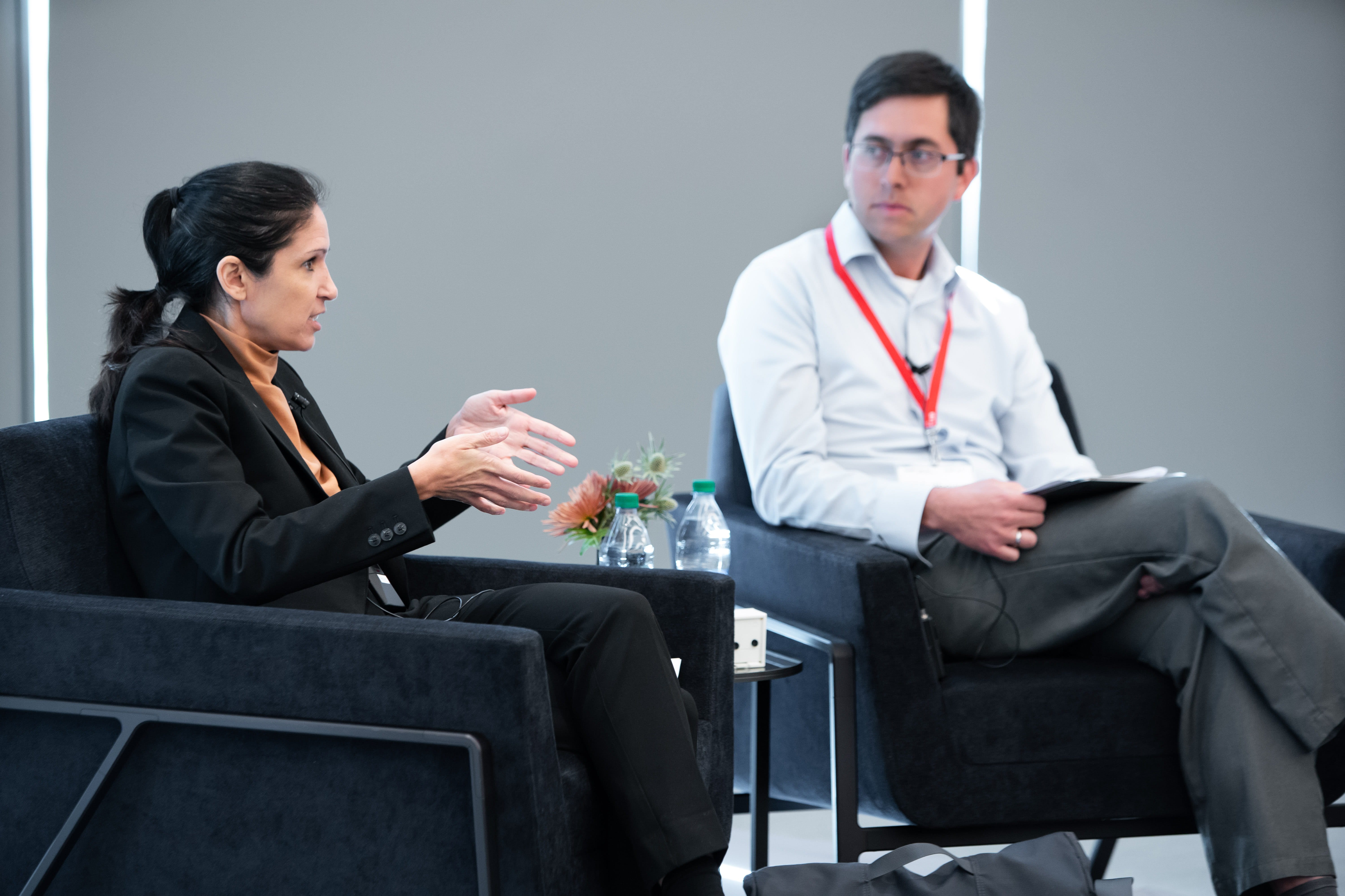 Marcella Alsan and Matthew Notowidigdo speaking at a conference