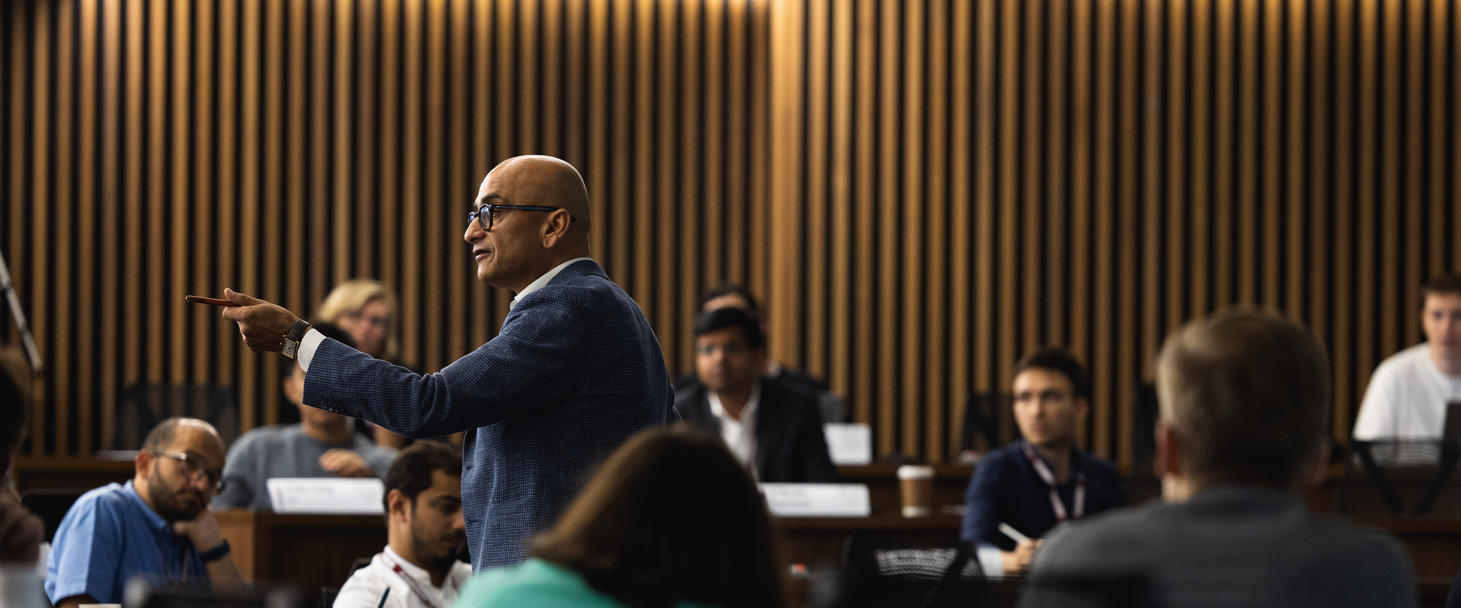 Haresh Sapra answering a question from a student in class