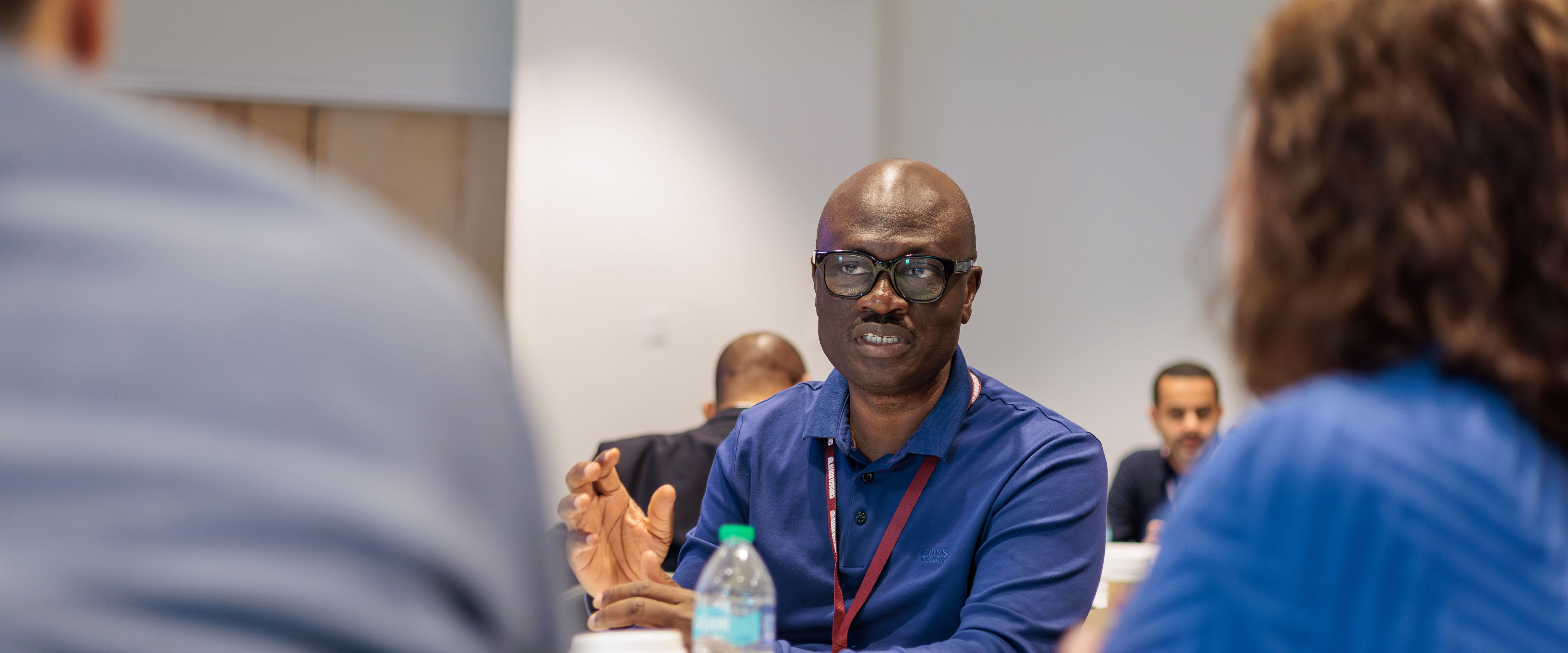 Executive discussing with others in a group