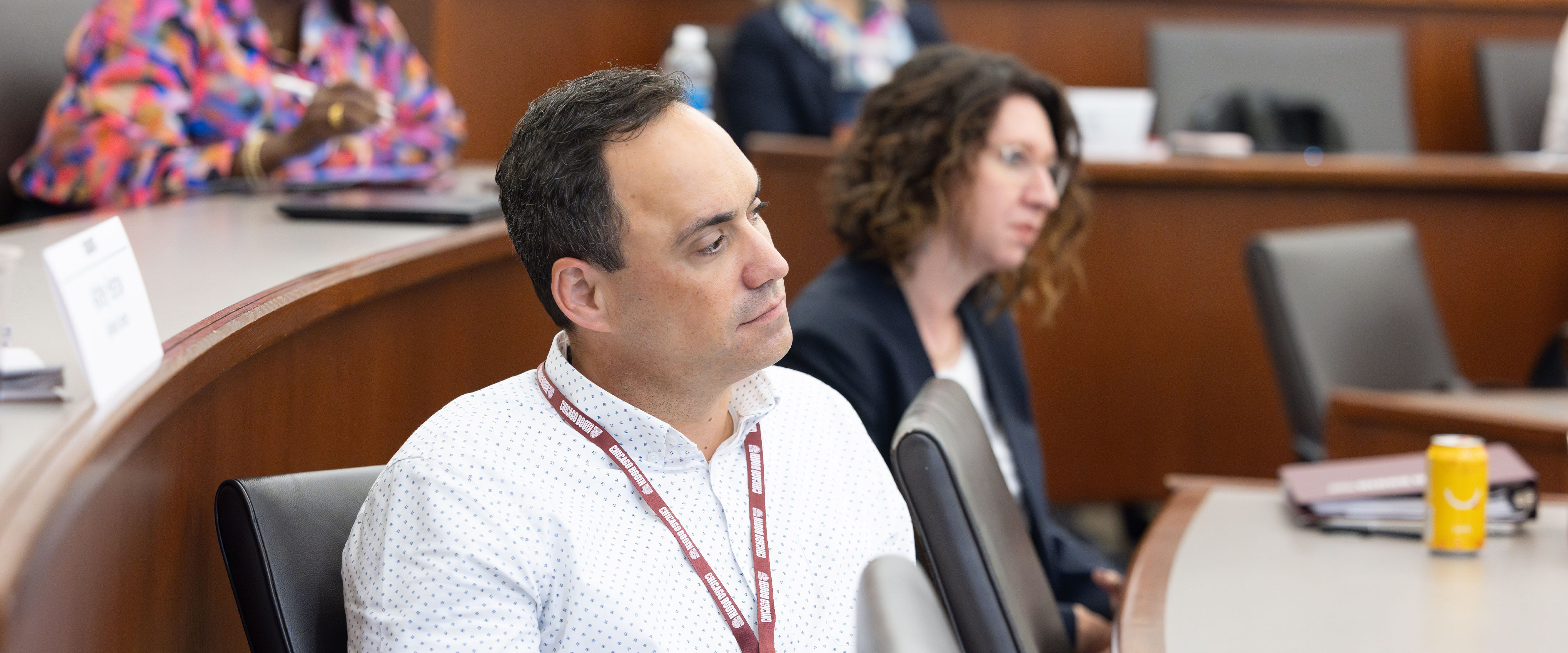 Student listening to professor in classroom