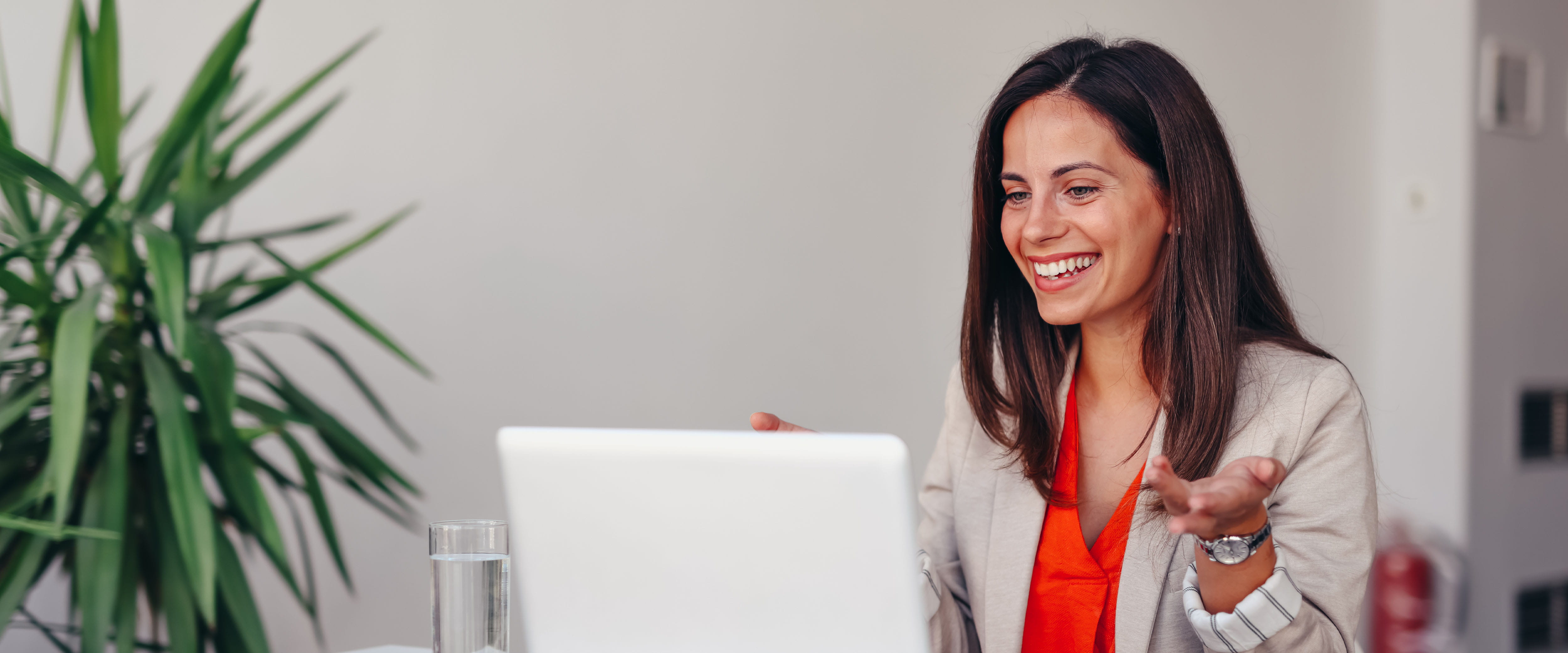 Executive looking at laptop smiling