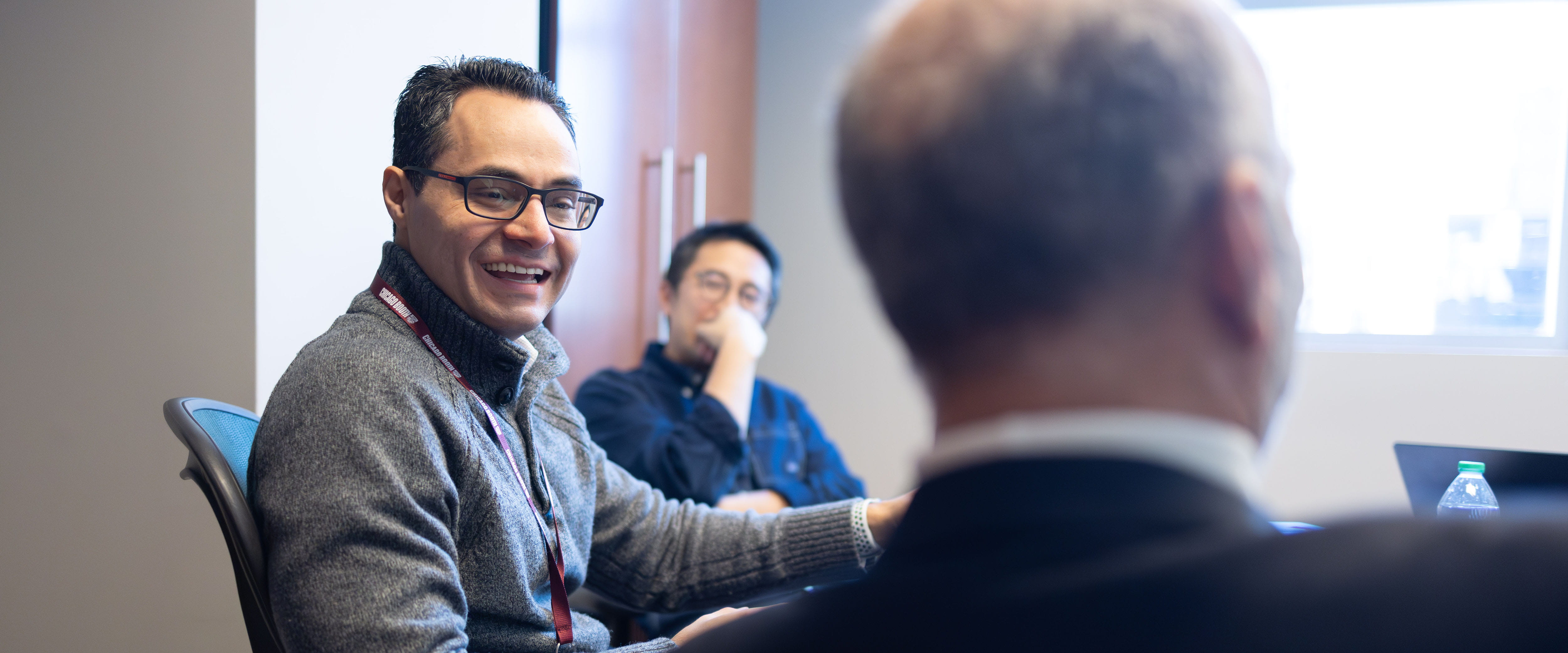 group of students discussing in a room