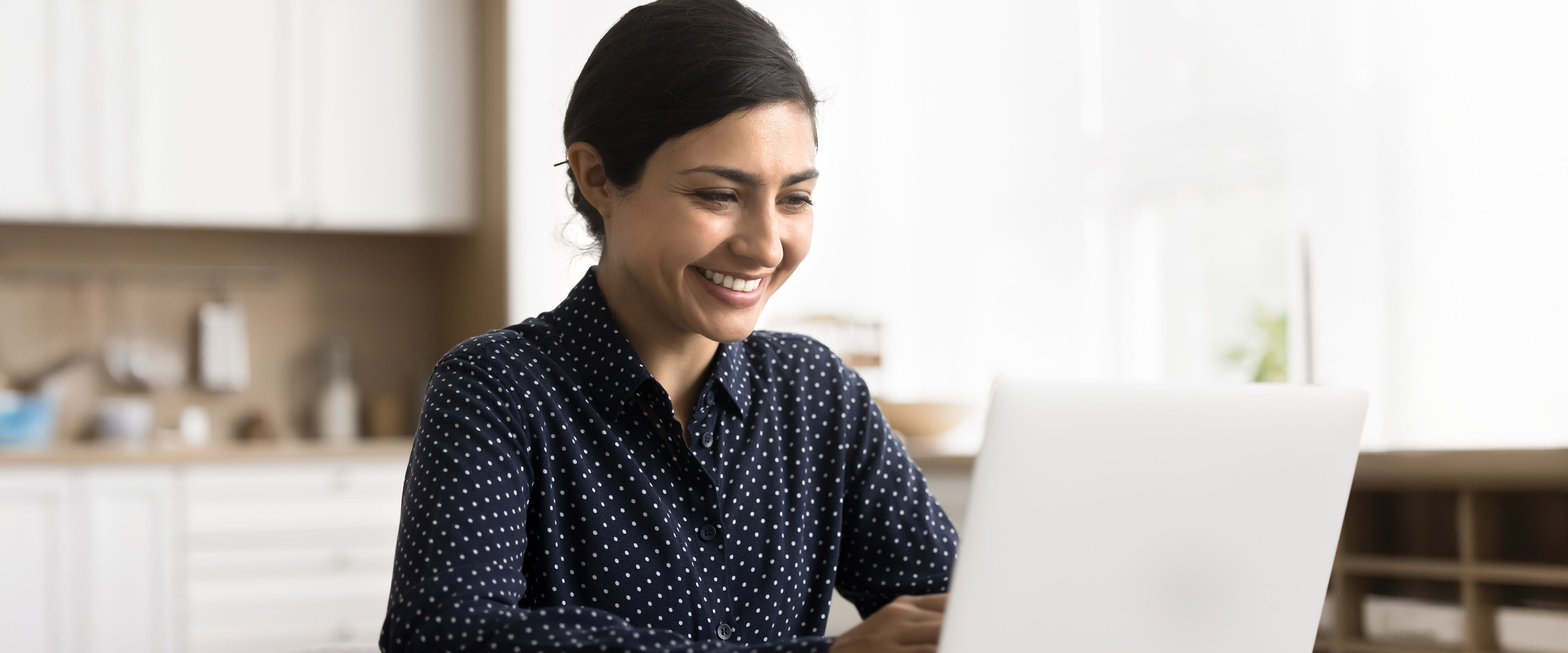 Discussing with others online through a laptop
