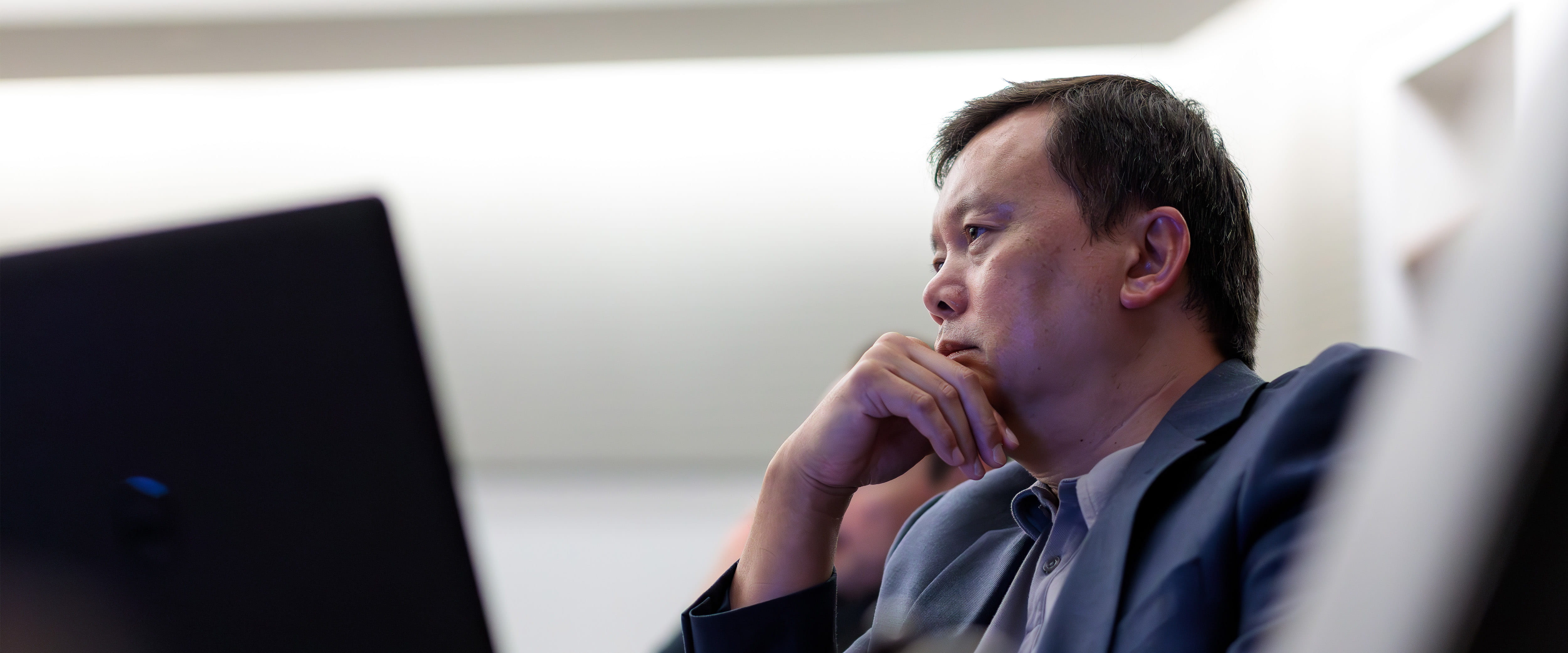 Student listening to other student in classroom