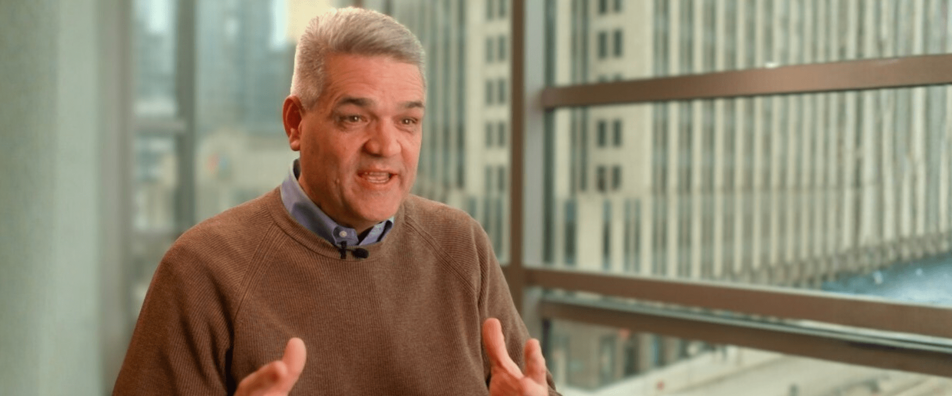 Nathan Yearsley speaking and gesturing with his hands.